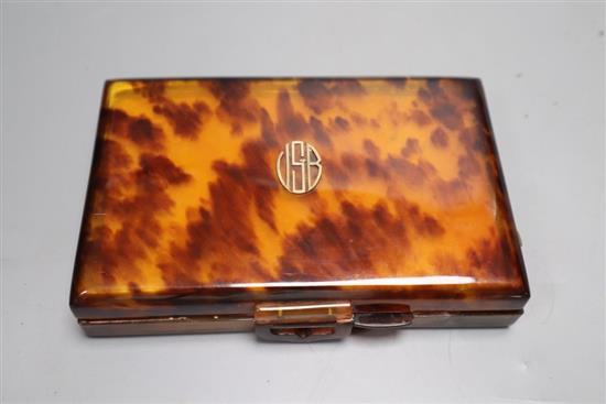 A 1930s tortoiseshell compact, 14cm